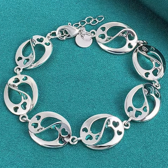 Elegant Silver Bracelet with Heart Accents - Picture 1 of 5
